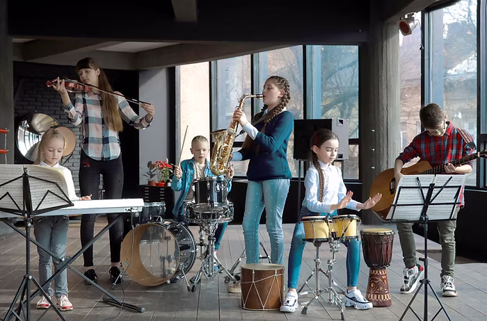 Children playing instruments in a band.
